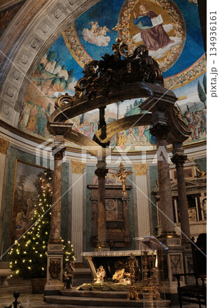 Basilica of the Holy Cross in Jerusalem Rome apse with mosaic baldachin and nativity scene Christmas decorations ornate Catholic church interior editorial use only. High quality photo 134936161