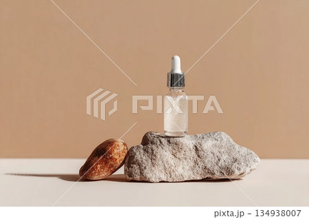 Glass dropper bottle with extract coconut or serum on stand from natural stones on beige background. Natural Organic Spa Cosmetic concept, cosmetic product mock up, minimal style. Side view, copyspace Glass dropper bottle with extract coconut or serum on stand from natural stones on beige background. Natural Organic Spa Cosmetic concept, cosmetic product mock up, minimal style. Side view, copyspace 134938007