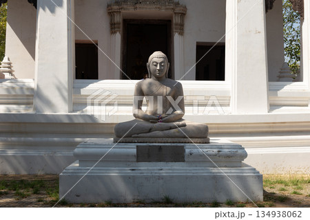 Buddha Statue Seated Outdoors at a Temple in Ayutthaya Thailand Buddha Statue Seated Outdoors at a Temple in Ayutthaya Thailand 134938062