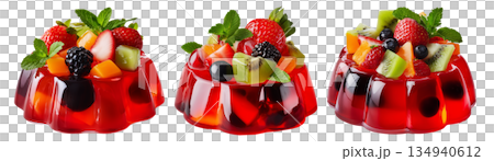 Bright red jelly salad dessert topped with fresh berries, mint leaves, marshmallows and candy isolated on white background Bright red jelly salad dessert topped with fresh berries, mint leaves, marshmallows and candy isolated on white background 134940612