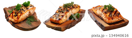 Grilled salmon steak topped with herbs and pepper, served on rustic wood board, isolated on white background, concept of seafood 134940616