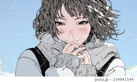 かじかんだ手に息を吹きかけて温めている若い女性