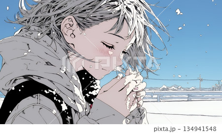 かじかんだ手に息を吹きかけて温めている若い女性