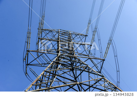 High voltage power poles from power plants. High voltage power poles from power plants. 134943828