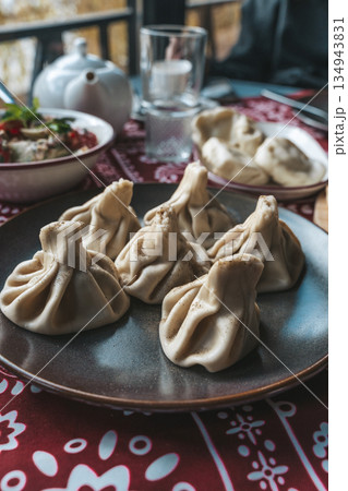 Traditional Georgian Khinkali Dumplings on a Plate Traditional Georgian Khinkali Dumplings on a Plate 134943831