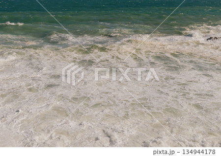 Natural marine background of stormy sea surface, powerful waves and white foam. Natural marine background of stormy sea surface, powerful waves and white foam. 134944178