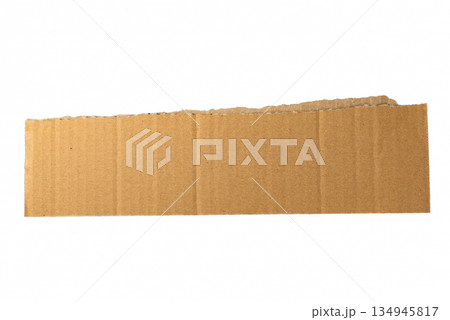 A horizontal piece of brown corrugated cardboard with a natural torn edge, perfect for banners, backgrounds, or a rustic design aesthetic. On a transparent background. 134945817