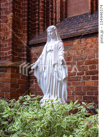 Virgin mary statue offering comfort and spirituality Virgin mary statue offering comfort and spirituality 134946374