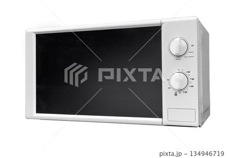 White microwave oven preparing food in kitchen White microwave oven preparing food in kitchen 134946719