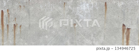 Weathered grey concrete wall showing rust stains Weathered grey concrete wall showing rust stains 134946725