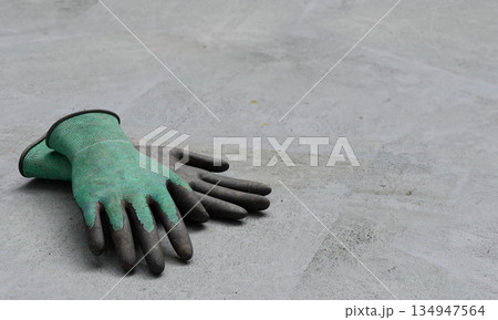 Industrial Cotton Work Gloves with Rubber Coating. 3D Rendering. Industrial Cotton Work Gloves with Rubber Coating. 3D Rendering. 134947564