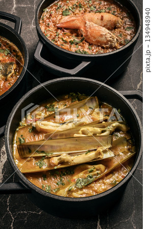 Portuguese traditional food fish soup  and seafood risotto meal on restaurant table in lisbon 134948940