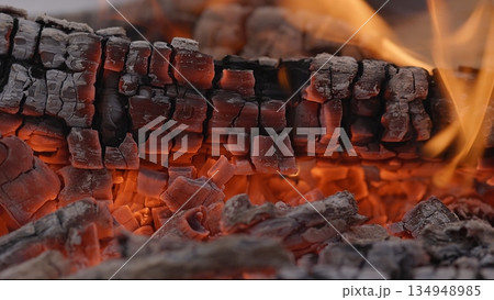 Close-up of Hot Embers with Flying Sparks . Concept of heating Fireplace Close-up of Hot Embers with Flying Sparks . Concept of heating Fireplace 134948985