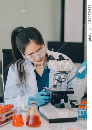 Portrait, science and happy woman on laptop in lab to research chemistry, test or innovation. Microscope, scientist and face of medical doctor in goggles for microbiology, healthcare or pharma study Portrait, science and happy woman on laptop in lab to research chemistry, test or innovation. Microscope, scientist and face of medical doctor in goggles for microbiology, healthcare or pharma study 134953453