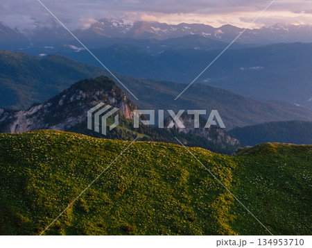 Mountains with dolomite rocks at sunrise with soft sunset light. Mountains with dolomite rocks at sunrise with soft sunset light. 134953710