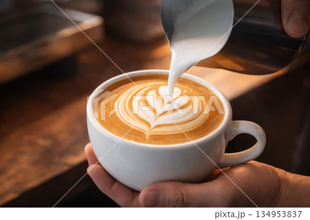 Professional Latte Art Creation with Steamed Milk in Coffee Shop Professional Latte Art Creation with Steamed Milk in Coffee Shop 134953837