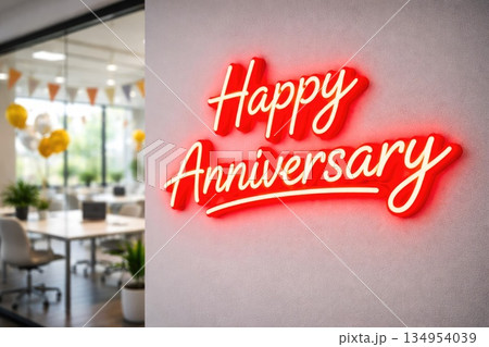 Bright Red Happy Anniversary Neon Sign on Wall in Festive Workspace 134954039