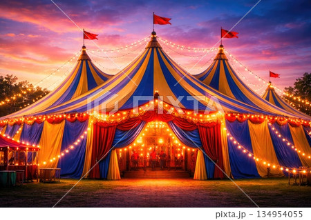 Illuminated Circus Tent with Decorative Lights at Sunset Festival Scene Illuminated Circus Tent with Decorative Lights at Sunset Festival Scene 134954055