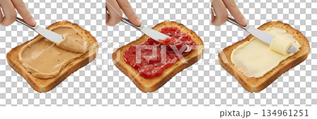 Process of spreading peanut butter, strawberry jam, and butter on slices of toasted bread to make a classic sandwich, isolated 134961251