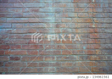 Wide red brick wall with uneven color and grunge texture 134961561