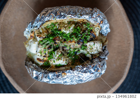 Baked Potato With Fresh Chives Topping Baked Potato With Fresh Chives Topping 134961802