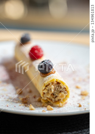 Rolled dessert with fresh berries garnish Rolled dessert with fresh berries garnish 134961813
