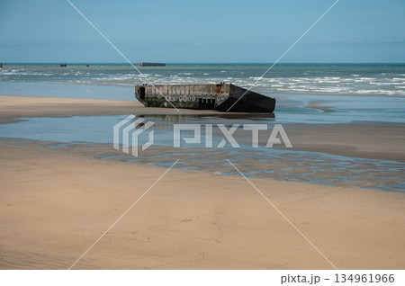 Visible remains of the Mulberry Harbour platforms on the beach of Arromanches-les-Bains, France. These massive concrete structures were used during the D-Day landings in World War II. Visible remains of the Mulberry Harbour platforms on the beach of Arromanches-les-Bains, France. These massive concrete structures were used during the D-Day landings in World War II. 134961966