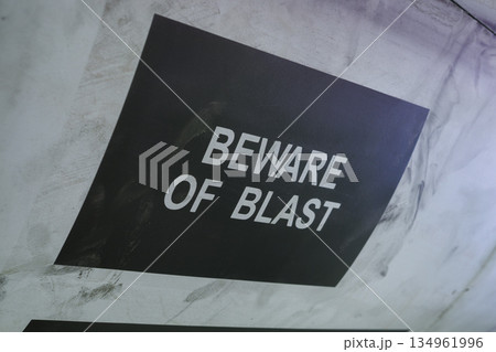 Warning sign beware of blast on aircraft fuselage surface 134961996