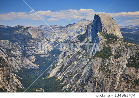 Half Dome Granite Cliffs and Forested Valley from Glacier Point Yosemite National Park Half Dome Granite Cliffs and Forested Valley from Glacier Point Yosemite National Park 134963474
