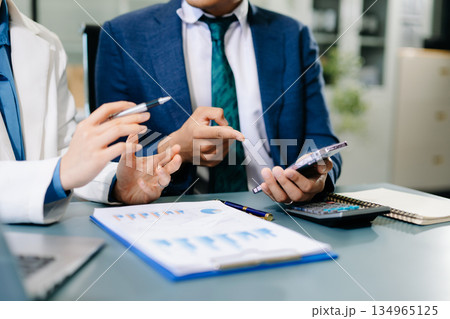 Businessman and team analyzing financial statement Finance task. with smart phone and laptop and tablet. Wealth management concept. Businessman and team analyzing financial statement Finance task. with smart phone and laptop and tablet. Wealth management concept. 134965125