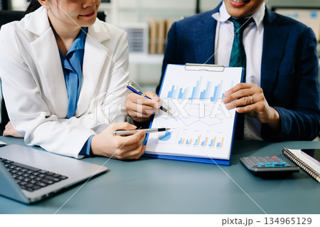 Business team meeting. professional investor working new start up project. Finance task. with smart phone and laptop and digital tablet computer 134965129