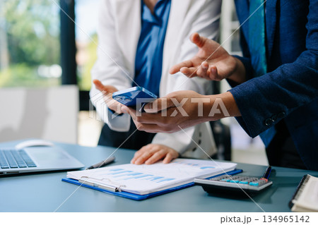 Businessman and team analyzing financial statement Finance task. with smart phone and laptop and tablet. Wealth management concept Businessman and team analyzing financial statement Finance task. with smart phone and laptop and tablet. Wealth management concept 134965142