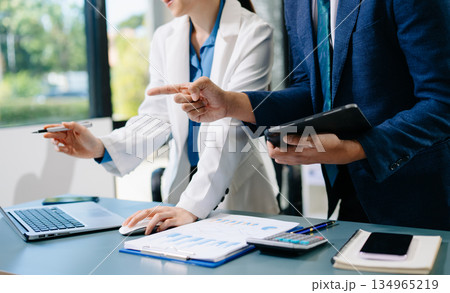 Team work process. Photo young business crew working with new startup project. Project managers meeting. Analyze plans, papers. Team work process. Photo young business crew working with new startup project. Project managers meeting. Analyze plans, papers. 134965219