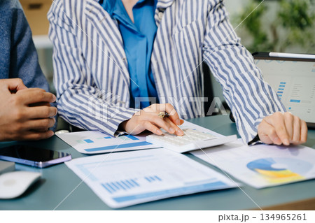 Businessman and team analyzing financial statement Finance task. with smart phone and laptop and tablet. Wealth management concept Businessman and team analyzing financial statement Finance task. with smart phone and laptop and tablet. Wealth management concept 134965261