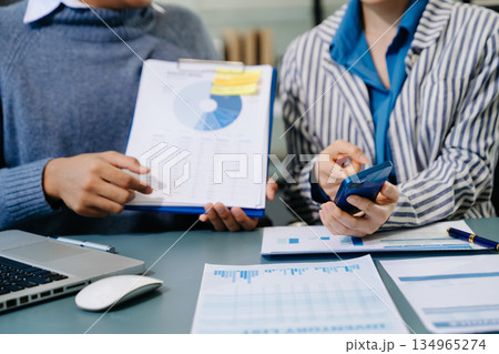 Businessman and team analyzing financial statement Finance task. with smart phone and laptop and tablet. Wealth management concept Businessman and team analyzing financial statement Finance task. with smart phone and laptop and tablet. Wealth management concept 134965274