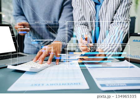 Project manager working and update tasks with milestones progress planning and Gantt chart scheduling diagram. business working with smart phone, tablet Project manager working and update tasks with milestones progress planning and Gantt chart scheduling diagram. business working with smart phone, tablet 134965335