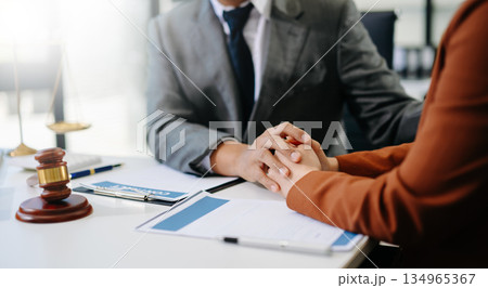 justice and law concept.Male judge in a courtroom on table and Counselor or Male lawyer working in office. Legal law, advice and justice concept. 134965367
