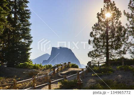 Half Dome and Sunburst Over Trail at Glacier Point Yosemite National Park California Half Dome and Sunburst Over Trail at Glacier Point Yosemite National Park California 134965772