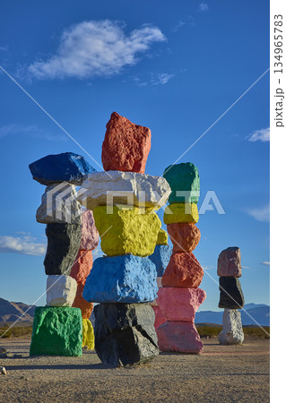 Colorful Rock Stacks at Seven Magic Mountains in Nevada Desert Under Blue Sky 134965783