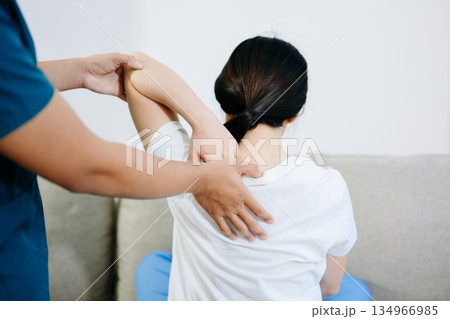 Healthcare professional providing back physiotherapy and pain relief treatment, showing patient recovery, rehabilitation, and physical therapy care support. Healthcare professional providing back physiotherapy and pain relief treatment, showing patient recovery, rehabilitation, and physical therapy care support. 134966985