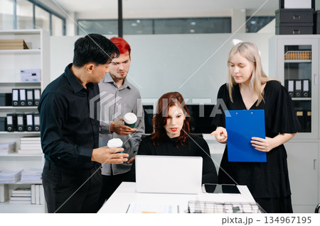 Office colleagues have a casual discussion. During a meeting in a conference room, a group of business teem sit in the conference room new startup project. Office colleagues have a casual discussion. During a meeting in a conference room, a group of business teem sit in the conference room new startup project. 134967195