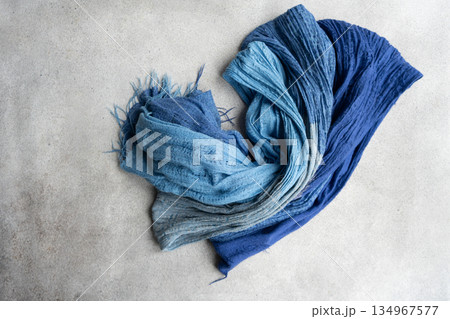 Soft textile scarf on the concrete background 134967577