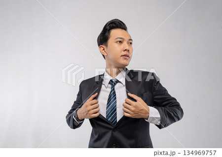 Selfassured founder adjusts attire before important meeting Selfassured founder adjusts attire before important meeting 134969757