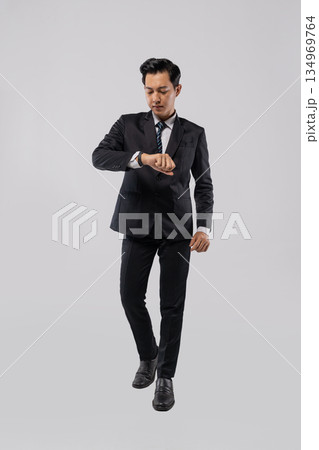 City executive walking confidently during daily commute City executive walking confidently during daily commute 134969764