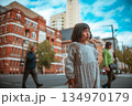 curious girl on urban street, asian girl in vintage dress observing surroundings 134970179