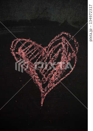 Chalk Heart Drawing on Dark Surface Represents Love for Valentine's Day 134972317