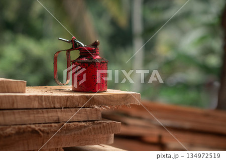 Oil Can Rusty On a Timber Plank Oil Can Rusty On a Timber Plank 134972519