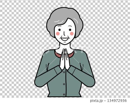 正面向き。いただきますと手を合わせるカーディガンを着た高齢女性。 134972936