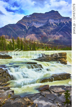Athabasca Falls Waterfall with Flowing Water and Majestic Mountain in Jasper Athabasca Falls Waterfall with Flowing Water and Majestic Mountain in Jasper 134972978