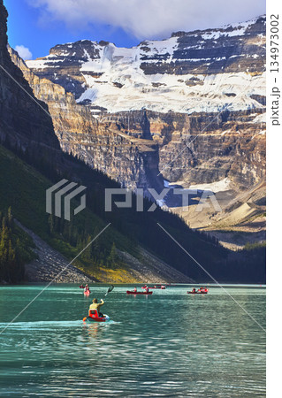 Canoe and Kayak Adventure on Turquoise Lake Water with Glacier Mountain Backdrop Canoe and Kayak Adventure on Turquoise Lake Water with Glacier Mountain Backdrop 134973002